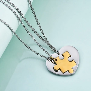 Matching heart and puzzle pendant necklaces for couples in polished silver and gold finish