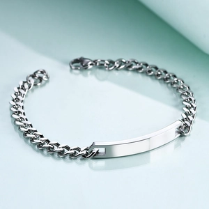 Detailed close-up of 7mm stainless steel Cuban link bracelet with engravable metal plate
