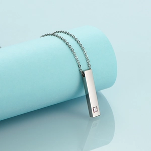 Minimalist stainless steel bar necklace with purple gemstone and mirror polished finish