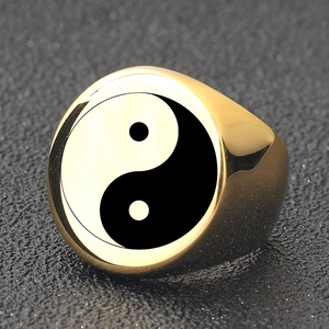 Polished gold stainless steel signet ring featuring a black and white Yin Yang symbol