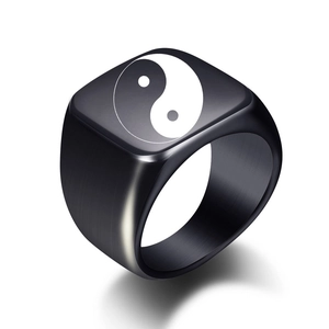 Close-up of laser-engraved Tai Chi Yin Yang symbol on square stainless steel signet ring