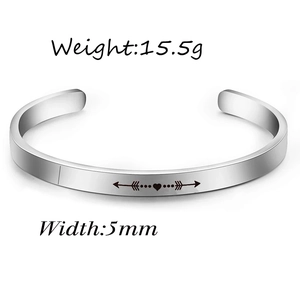 Silver 5mm stainless steel cuff bracelet with engraved arrow heart pattern and polished finish