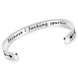 Detailed close-up of 6mm silver stainless steel cuff engraved with Because I fucking sparkle