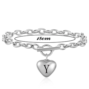 Detailed view of silver heart pendant with letter Y and OT buckle on link bracelet