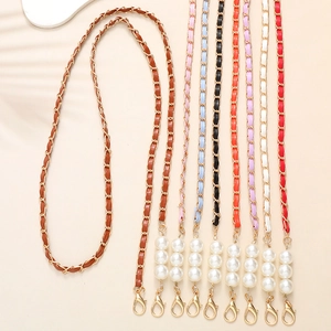 Braided leather and gold metal phone strap with elegant pearl accents and lobster clasp