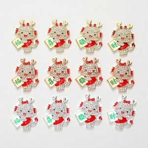 Detailed macro view of 12-piece rhinestone dragon charms with festive Chinese characters