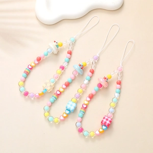 Detail of beaded phone charms featuring pastel macaron colors and cute cartoon duck pendant