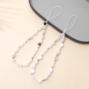 Elegant pearl wrist strap phone lanyard with gold accents and a lettered bead ornament