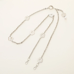 Silver metal floral phone chain with plum blossom charms and white pearl pendant detail