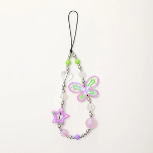 Detailed macro of the butterfly and star beaded phone strap in purple and silver