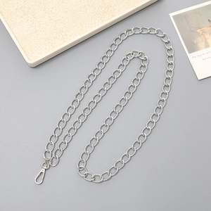 Detail shot of a silver textured metal chain with spring clasp for phone or bags