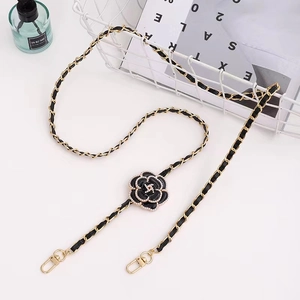 Crossbody phone chain with leather strap, camellia flower and pearl charms in black and gold