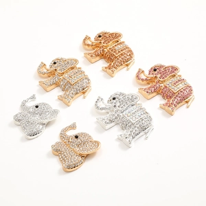 Detailed close-up of sparkling rhinestone-encrusted elephant jewelry charms in various colors