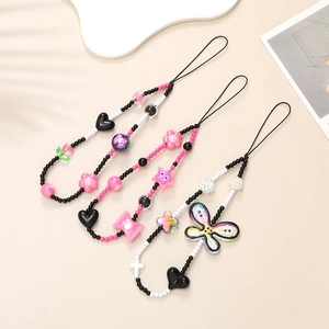 Pink Y2K beaded phone charms featuring heart, star, and butterfly charms in a set