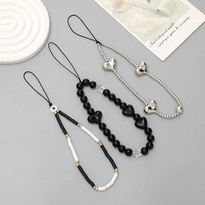 Three beaded phone charms with heart and evil eye beads in black and silver finishes