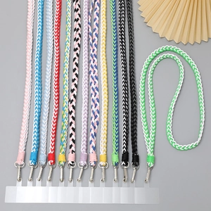 Detail of colorful braided phone lanyards with silver rotating hooks and clear pads