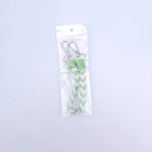 Handwoven green and white phone wrist strap set with silver metal lobster clasps