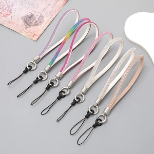 Sparkly rhinestone wrist strap phone charms in six vibrant colors for women