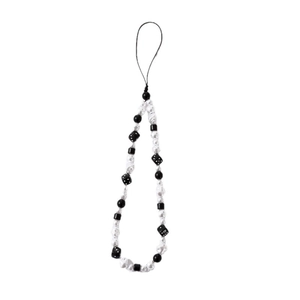 Handmade black and white beaded phone strap with pearls and dice charms for mobile cases
