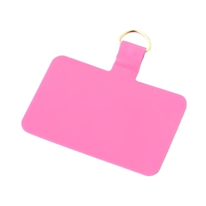 Bright pink TPU phone lanyard patch with golden D-ring connector on white background