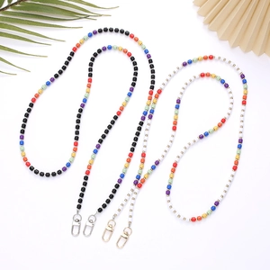 Colorful beaded crossbody straps with lobster clasps shown on a white background decor