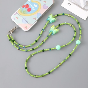 Pastel green beaded phone lanyard with translucent butterfly charms and silver lobster clasp