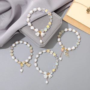 Elegant lily of the valley pearl and crystal bead bracelets with gold floral charms