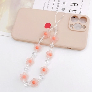 Detailed macro view of pink acrylic frosted flower beads on a sweet style phone lanyard