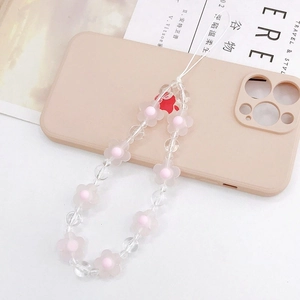 Pink frosted acrylic flower beaded phone strap with clear faceted charms on phone case