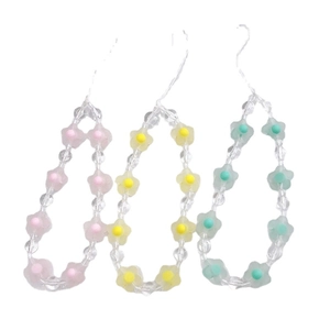 Three colorful acrylic flower beaded phone straps in pink, yellow and cyan blue colors