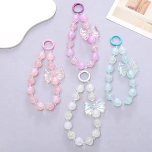 Detailed view of colorful beaded phone straps with glossy bows and matte acrylic beads