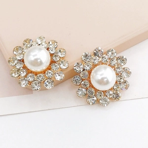 Zinc alloy sunflower earrings with white pearls and sparkling rhinestones in gold setting