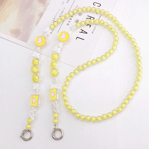 Handmade yellow beaded phone strap with acrylic butterfly and pink heart charms