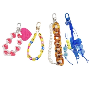 Handmade beaded charms with acrylic hearts and smiley faces for phone cases and keychains