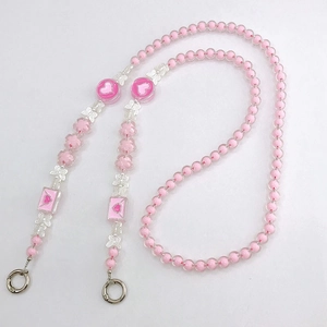 Pink beaded crossbody phone strap with acrylic heart and silver butterfly charms
