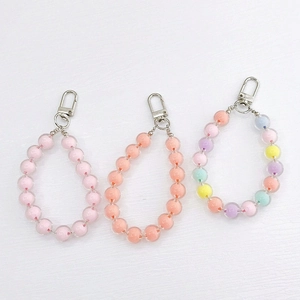 Detailed view of colorful acrylic beaded charms with silver metal lobster clasps