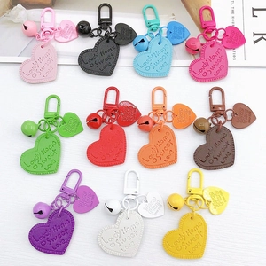 Colorful heart-shaped leather keychains with mini bells and sweet love embossing