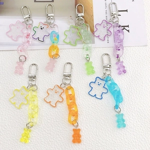 Detail of colorful acrylic bear keychains with metal clasps in seven candy color options