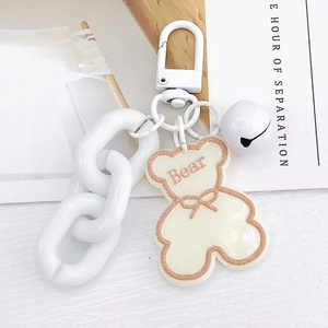 White acrylic bear keychain with chunky chain and bell for handbags and earphones