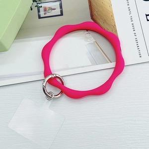 Neon pink wavy silicone phone wristlet strap with silver spring clip and clear connector