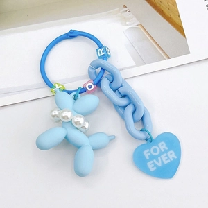Detailed macro view of blue balloon dog keychain with FOR EVER heart charm and beads