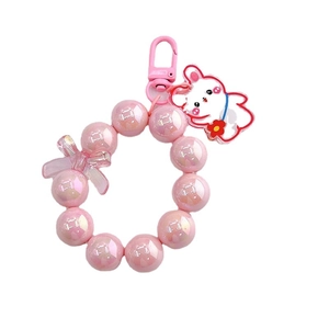 Portachiavi con perle rosa cangianti con ciondolo a coniglio bianco e fiocco rosa