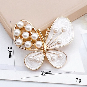 Golden butterfly brooch with white pearls and enamel, size 35mm x 29mm, weight 7g