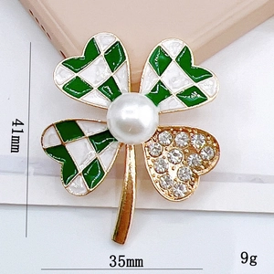 Gold four-leaf clover brooch with green checkerboard enamel, pearls and rhinestones
