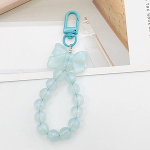Detailed view of light blue beaded keychain with a matching bow and lobster clasp