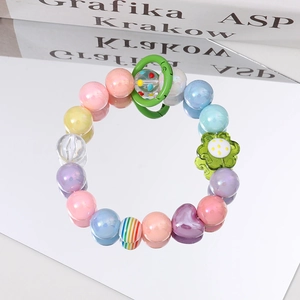 Detail of colorful acrylic bead strap with rainbow charms and purple heart pendant