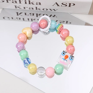Handmade macaron beaded bracelet with cute cartoon charm and yellow heart bead accent