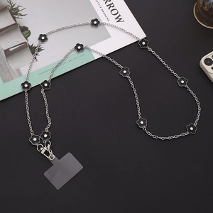 Detailed view of silver metal phone chain with black floral accents and clear TPU patch