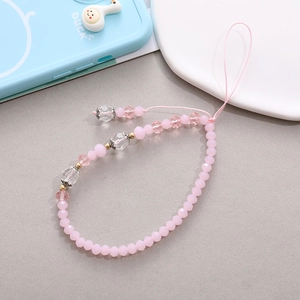 Close-up of pink beaded phone strap with frosted beads and faceted crystal accents