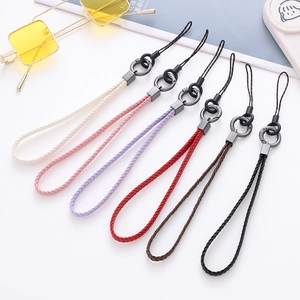 Close-up of woven leather phone lanyards in six colors with metallic gray buckle detail